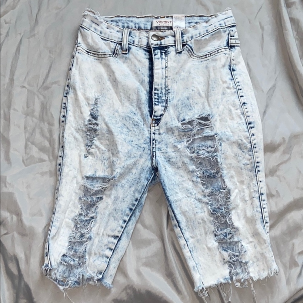 Light denim distressed shorts.